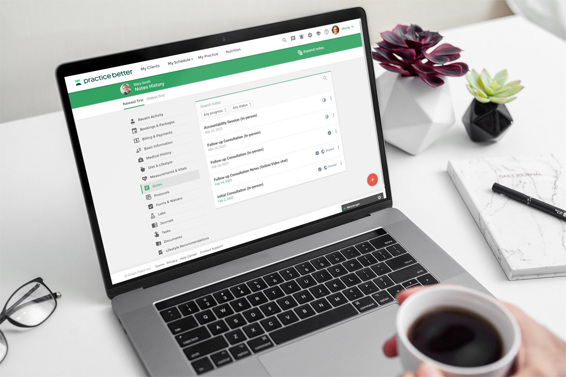 mockup-of-a-macbook-pro-placed-on-a-white-work-desk-next-to-some-plant-pots-495-el (1)